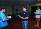 The Olney American Legion Post 414 performed a flag retirement ceremony on Sunday evening. The ceremony includes a flag inspection and prayer shown here. City Councilmember and Legion Chaplain Steven Nurre, Post Vice Commander Eric Loggins, and Post Comma