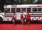 Calvary Cone Express opened across from Allsup’s in Olney off Main Street and offers a variety of delicious, flavored snow cones. Shown are Calvary Cones owner Mari Behrens [upper left] with her children, who are her helpers: Agape, RJ, Bliss, Grace, an
