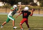 A Bobcat defender rushes the Rotan quarterback, who rushes the throw, which falls right into the hands of a Bobcat defender for an interception. Photo by Will Sadler