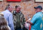 Precinct 3 Commissioner Alan Craig visits with Olney Economic Development Corporation executive director Tom Parker and Spencer and Debbie Key at Hudson’s. Photo by Will Sadler