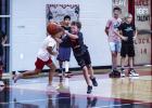 Attendees of the Cub Basketball Camp practiced passing and dribbling through one of many games aimed at making learning and skill building fun. Photo by Will Sadler