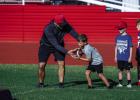 OISD coaches give individual attention to camp attendees, each coach passing on skills and making sure campers are still having fun to build excitement for football. Photo by Will Sadler