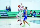 NJH Bobcat #35 Leon Creel with a break away from a Longhorn defender for a layup. Photo by Will Sadler