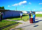 The second half of American Legion Post 414’s flag retirement ceremony took place outside and included the playing of “Taps” and the respectful burning of flags no longer in peak condition for displaying on flag poles. Photo by Will Sadler