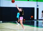Future Varsity Ladycat is hyper-focused during shooting drills at the Dollar summer basketball camp. Photo by Will Sadler