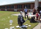 Caleb Fobbs hits Mr. Berngen during the ‘Pie the Principal’ event at Olney Junior High School. Photo by Logan Phillips