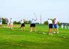 Golfers attending the Olney Country Club’s McClatchy Tourney warm up before tee off on the driving range and putting green. Photo by Will Sadler