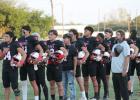 The Olney Cubs Varsity Football team making the Pledge of Allegiance at the start of their Sept. 18 Homecoming victory over the Archer City Wildcats at Cub Stadium. Photo by Kailyn Altmiller
