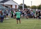 Newcastle ISD Athletic Director and Head Bobcat Football Coach Asiah Archer goes over the importance of the annual tradition of Tackle with Moms. Coach Archer said in part that the event helps show what players go through during practice. Photo By Will Sa