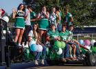 Newcastle High School adorned floats and trailers to proudly parade down Newcastle’s streets during Homecoming Week. Shown are the NHS cheerleaders and Bobcat footballers. See more coverage of parade and game on Page 10 Photo by Will Sadler
