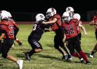 Cub Midget #50 Blaine Owen and #62 Braxton Wales clear the way for the Cub runner. Photo by Will Sadler