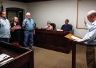 City Attorney Bill Myers swears in City Council members (L-R): Steven Nurre, Thea Sullivan, and Chuck Stennett, for new terms on June 9. Photo by Will Sadler