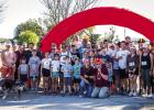 Shown are the participants and volunteers of the Sixth Annual Turkey Trot at Tom Griffin Park on Sunday, Nov. 16. Participants warmed up with a prayer and a chicken Photo by Will Sadler
