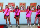 OHS Lady Cubs [L-R] #3 Bradi Bowers, #10 Allison Alvarado, #7 Rai Bond and #12 Morgan Simmons start a new tradition of leaving their mark with red paint hand prints during Senior Night. Photo by Will Sadler