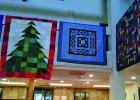 Cross Timbers Stitchers Guild is displaying quilts in the Olney InterBank lobby, and offering several quilts for sale to benefit local charity. Photo by Gina Keating