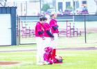 Olney Cubs pause to give respect during the singing of the national anthem before their matchup with the Petrolia Pirates. Photo by Will Sadler