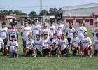 Sixth-ninth grade football camp attendees pose for a team photo. Most of these players have been playing together in backyards and on playgrounds since knee-high. Photo by Will Sadler