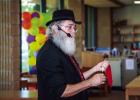 Ron Wilson recently performing at the OCLAC. Shown performing a classic handkerchief trick, changing it from one color to another as he passes the kerchief through his hand. Photo by Will Sadler
