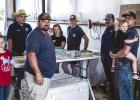 The annual NVFD fish fry takes a small army of workers to make the event a success but family, friends and community members rolled up their sleeves and worked side by side with firefighters feeding hungry attendees. Photo by Will Sadler