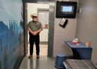Young County Sheriff Travis Babcock standing in a jail cell specially designed to calm and protect inmates from harming themselves Photo by Gina Keating