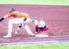 OHS Cub #8 Jamarcus Collins played cat and mouse with the Pirate Pitcher but after several attempts could not catch the Cub off base. Photo by Will Sadler