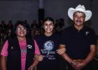 Flor is escorted by parents Norma and Lorenzo Carranza during Senior Night. Photo by Will Sadler