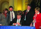 Olney resident Richard Harding, second from right, with wife Debra and Colorado Gov. John Hickenlooper at the signing of a speciality tax for rural hospitals that he championed for Montrose County hospitals. Photo provided by Richard Harding