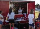 The Olney Athletic Booster Club trailer was very busy during the Meet the Cubs event thanks to great deals on Cub and Lady Cubs merchandise - $5 for everything! Photo by Will Sadler