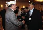 Olney American Legion Post #414 Commander Chris Garcia shakes hands with outgoing State Commander Tom Marty after being swqorn in as District Commander. Photo courtesy of Chris Garcia
