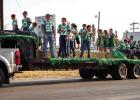 Newcastle Junior High Bobcat football players and cheerleaders show their school pride during the NHS HOCO Parade. | Photo by Will Sadler