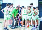 Coach James King gives instructions to the Bobcats early in the match. Photo by Will Sadler