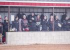 The OHS Lady Cubs didn’t let a cold and drizzly day ruin their fun, cheering on teammates and some good old chatter at the opposing Lady Panthers. Photo by Will Sadler