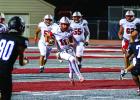 Cub #11 Tucker Cortinez QB scrambling out of the pocket, keeping the drive alive. Photo by Will Sadler