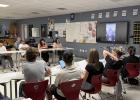 OHS student council and National Honor Society members and their parents watch a videotaped message from Netflix co-founder Marc Randolph, who shared how his experience at NOLS as a student and guide helped him become a successful leader. Photo by Will St