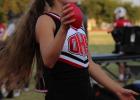 Cheerleader Ava Stewart launched mini footballs into the stands during the Cubs home opener with the Petrolia Pirates. Photo by Gina Keating