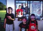 The Behrens family, owner-operators of Calvary Cones Express, served their delicious snow cones from their bus. Photo by Will Sadler