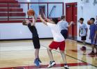 New basketball coach hosts