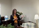 Olneyite Kaci McKinzie, the new director of Virginia’s House, talks to Olney community members about the nonprofit children’s advocacy group at a meeting at the home of Mayor Rue and Anna Rogers last week. Photo by Chad Edgington