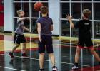 One camp one activity had Cubs in groups of three passing the ball as they dribbled from one end of the court to the other. Photo by Will Sadler