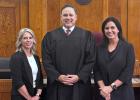District Judge Phillip Gregory stands with Young County’s new district clerk, Stacey Mallory (L) and outgoing clerk, Jamie Land (R). Photo courtesy of Judge Phillip Gregory