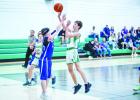 NJH Bobcat #10 Liam Banner shoots a floater over a Longhorn defender. Photo by Will Sadler
