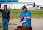 Olney Post 414 Chaplain Steven Nurre retires flags to the flames during the Sunday flag retirement ceremony. Photo by Will Sadler