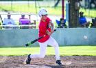 Young athletes like KP Patterson at bat are getting the opportunity to gain valuable experience over the summer by playing alongside older more experienced players. Photo by Will Sadler