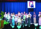 Senior Allison Alvarado leads the Class of 2026 in the Pledge of Allegiance before the state of Senior Awards Night. Photo by Will Sadler