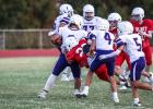 OJH Cub #23 Angel Altuve launches himself at a Plowboy runner for a tackle. Photo by Will Sadler