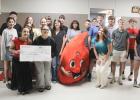 A representative of Carter BloodCare came to Olney High School Wednesday, Sept. 23, to present the National Honor Society with a $500 check. Pictured with the donation are (front, L-R) Braelyn Casteel, Jordynn Petty, Maddox Johnson (as Buddy the Blood Dro