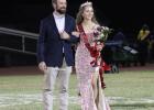 OHS senior Ava Stewart stands with her father, Will Stewart, at the 50-yard line in Cub Stadium after Ava was named 2026 Homecoming Queen on Sept. 18. Photo by Gina Keating