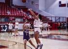 OHS Lady Cub #24 Angel Turner shooting outside the paint against a Lady Buckaroo defender. Turner was a much-needed athlete this season for both volleyball and basketball. She brings confidence and controlled aggression to the boards this season. Photo by