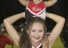 Olney High School Cheerleader Emma Barrington hold up Carliegh Symank while the cheerleading team raised funds for the Cooks Children Hospital Solid Tumor Research Fund.  Jimmy Potts/Enterprise