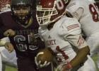 Olney High School freshman Junior Acuna grinds out a few yards during the Cubs' season finale against Seymour.